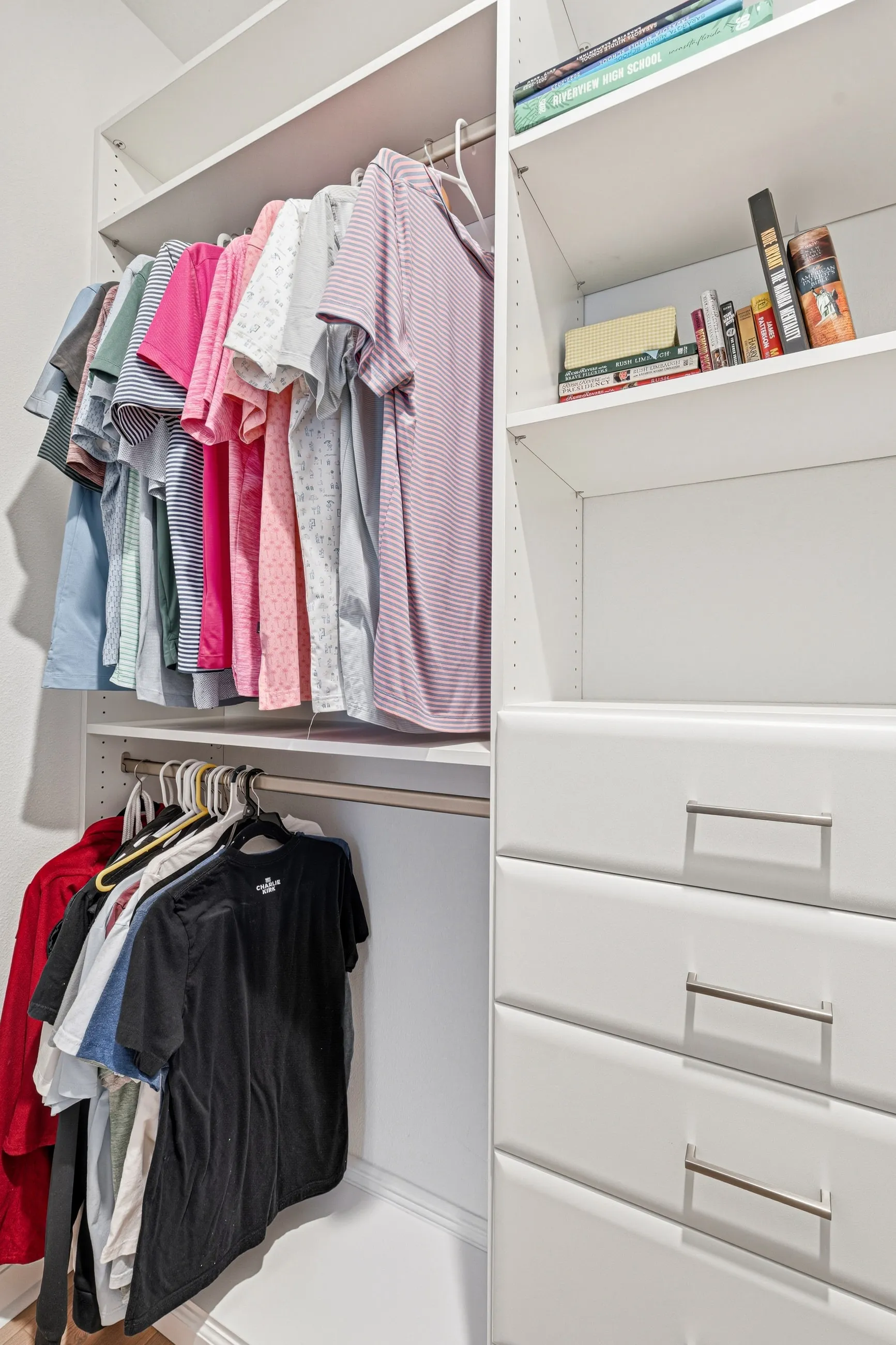 Closet with double-hang rods and drawer storage maximising wardrobe capacity in Bradenton, FL