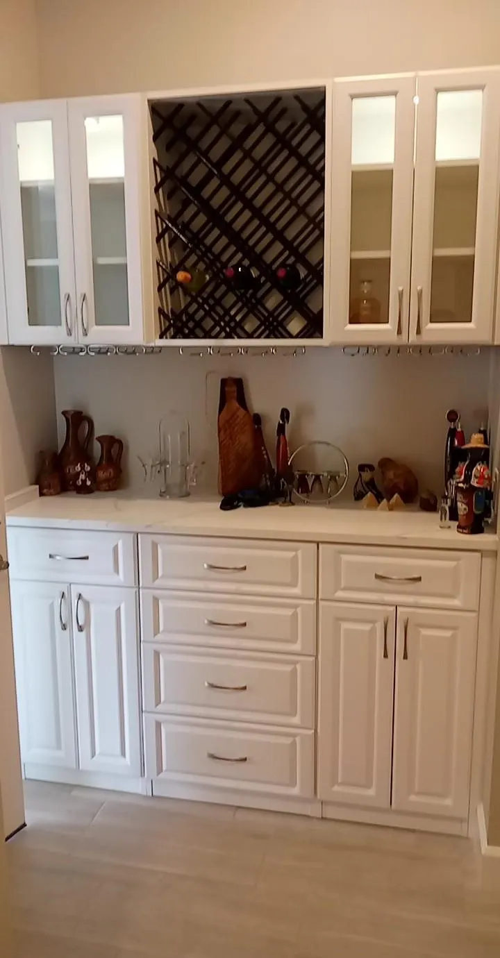 Custom butler’s pantry with a lattice wine rack, glass-front cabinets and a stemware rail in Sarasota, FL