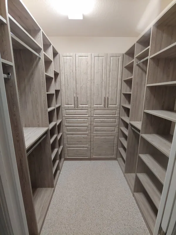 Custom walk in closet — custom storage designed and installed by Dream Closets