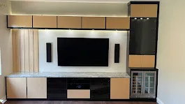 Modern two tone media center led accent lighting — custom storage designed and installed by Dream Closets in Lakewood Ranch, FL