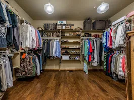 Organised walk-in closet with clothes and shoe display in Bradenton, FL