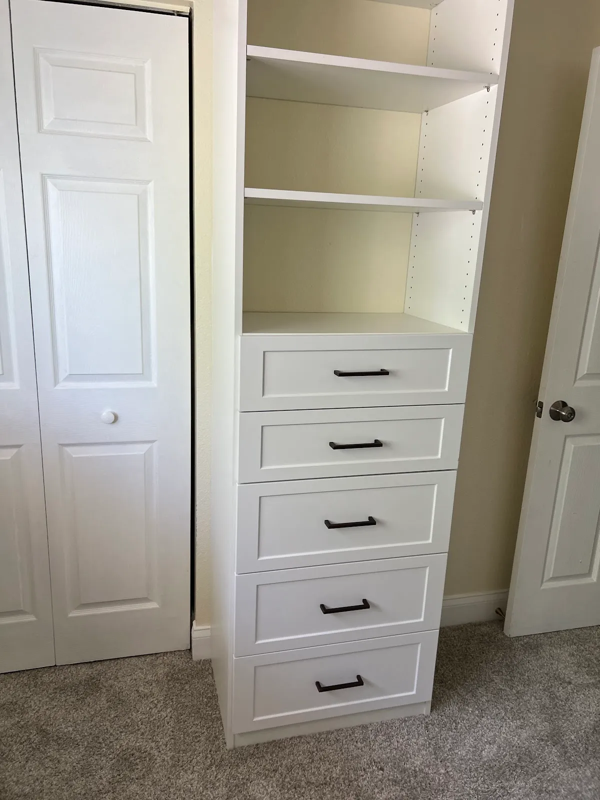 Reach in closet drawer tower — custom storage designed and installed by Dream Closets in Lakewood Ranch, FL