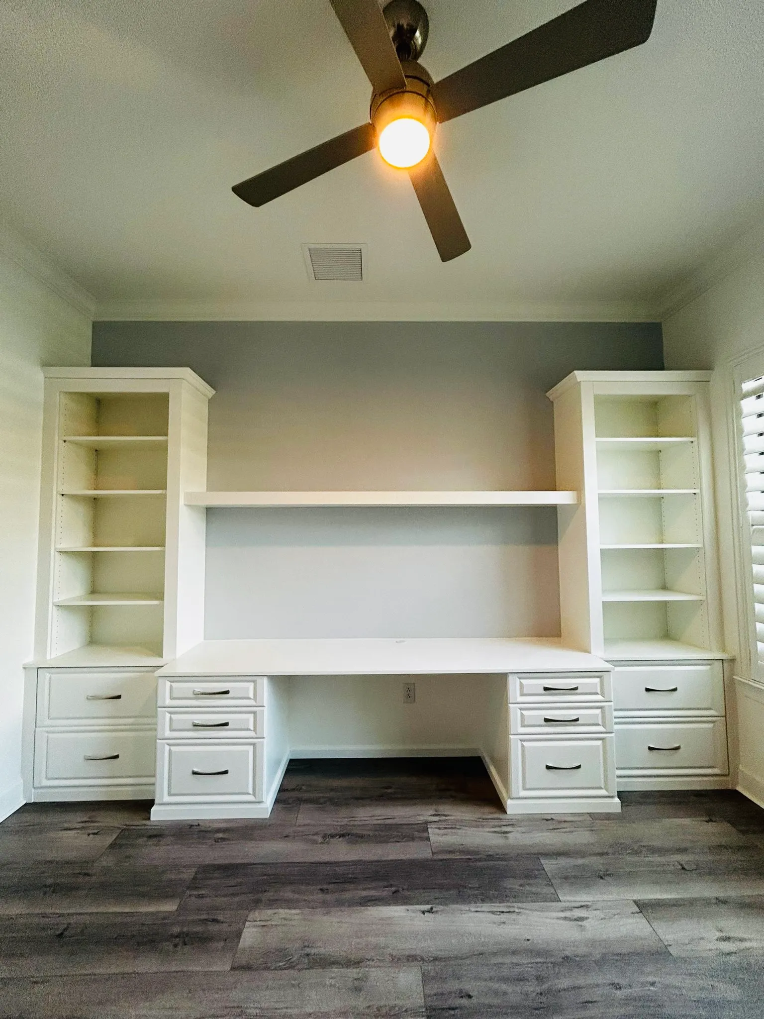 Walk in closet white finish — custom storage designed and installed by Dream Closets in Bradenton, FL